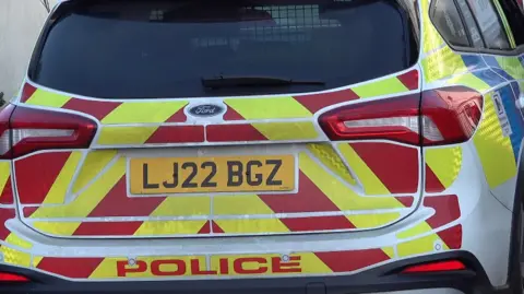 BBC The back of a police car