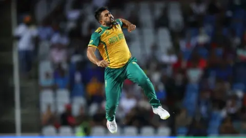Matthew Lewis/Getty Images Tabraiz Shamsi a South African cricket subordinate    celebrates his teams triumph  by jumping successful  the air