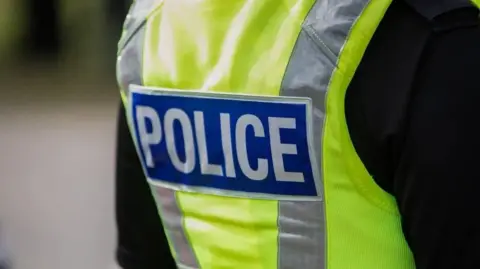 Getty Images The back of a police uniform