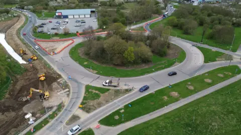 A drone shot of the Ennerdale roundabout. Roadworks can be seen taking place on part of the roundabout. 