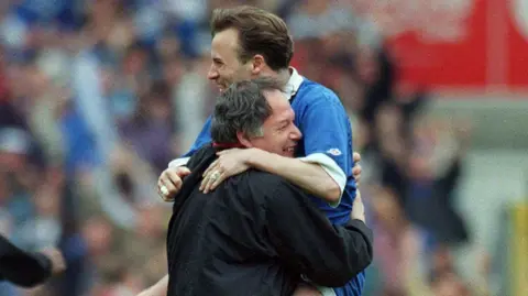 Barry Fry and Mark Ward celebrate victory over Carlisle in the 1995 EFL Trophy - then Auto Windscreens Shield - final