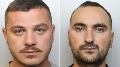 Police custody images of Endrit Nikolli (left) with brown hair wearing a grey t-shirt and beard and Sidorjan Lleshi with dark brown hair and beard and wearing a black t-shirt.
