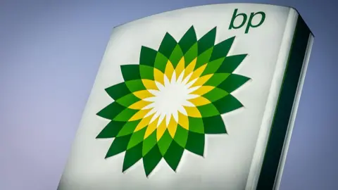 A large BP sign, with the green and yellow geometric flower logo.