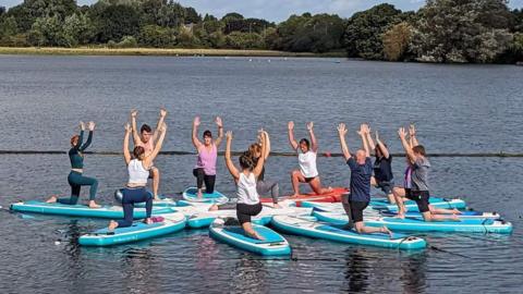 Yoga class on paddleboards