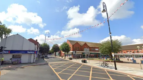 Brierley Hill High Street lines with lampposts which have bunting strung between them