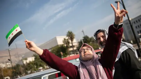 Woman celebrates in Damascus 