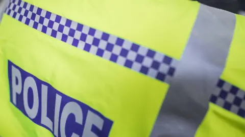 Getty Images A stock photo of a police officer's fluorescent jacket.