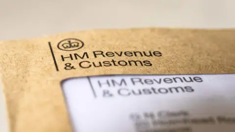A brown envelope with black writing which says 'HM Revenue & Customs'.