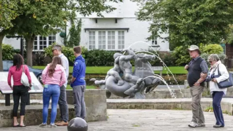 Port Sunlight Village Trust People stand by the pond and fountain when it flowed