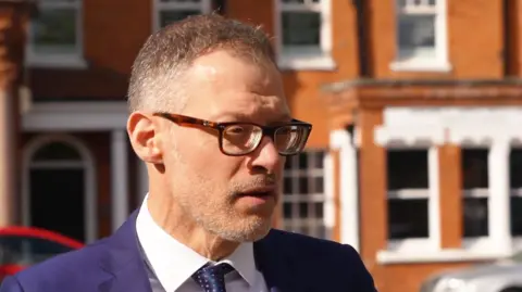 Martin Giles/BBC Councillor Adam Zerny 