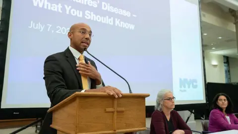 At the town hall on the Upper East Side church this week, New York City Health Commissioner Alister Martin speaks