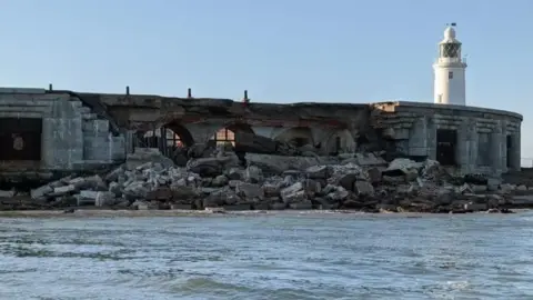 James Brooke A section of Hurst Castle collapsed after the sea weakened its foundations. It is a sunny day. 