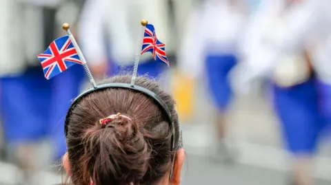 Getty Images The back of a girls head wearing a Union flag headband.