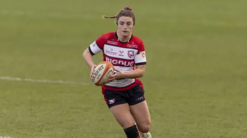 Gloucester-Hartpury rugby player Rachel Lund carrying the ball during a Premiership Women's Rugby match