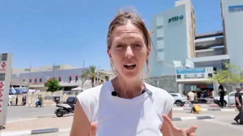 BBC correspondent Lucy Williams, outside Soroka Hospital in Beersheba, Israel