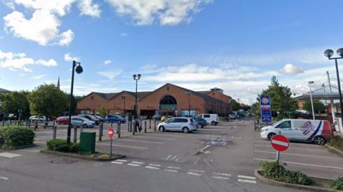 A Google picture of the car park outside of Waitrose in Newark, with about 10 cars in