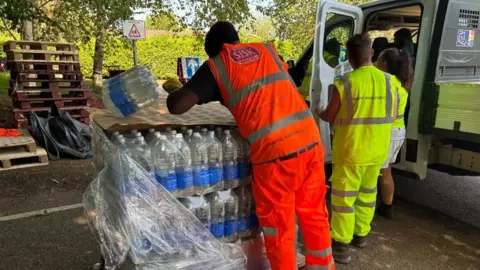 Bottles of water being unloaded in Challock, Kent
