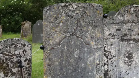 University of Leicester Gravestone in a field
