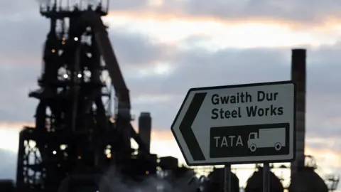 Steel works sign and old furnace in the background