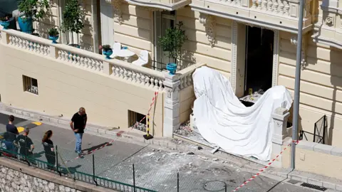 EPA The entrance of a residential building in Monaco after a suspected parcel bomb explosion on 29 June, 2026.