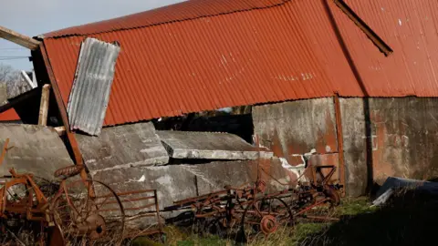 Reuters A red roofed barn with a collapsed roof in County Galway 