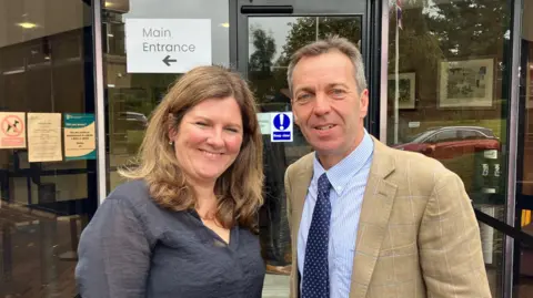 Tenant farmers Emma and Rob Sturdy stand outside the venue for the public inquiry, in Malton. The inquiry is after Harmony Energy appealed against a decision to refused permission for the firm to build a solar farm on a large part of the Sturdys' land.