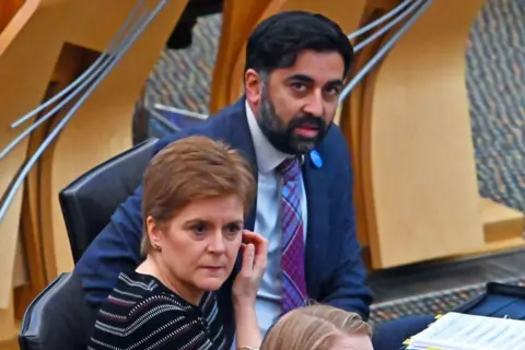 Getty Images Nicola Sturgeon and Humza Yousaf in the Scottish Parliament chamber.