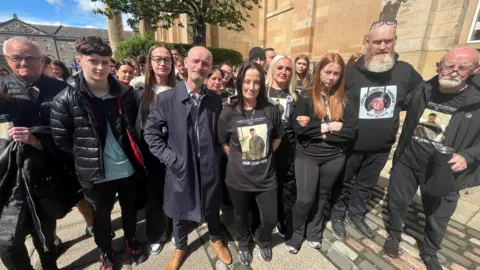 Lisa Petrie with family and friends outside the High Court in Dundee