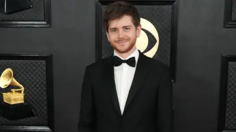 Getty Images Oli Jacobs attends the 65th GRAMMY Awards in 2023.