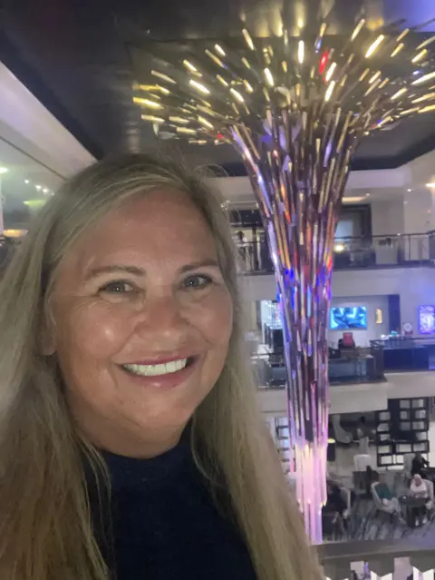 Wendie Smith Wendie, a white woman in her 50s, on a cruise ship