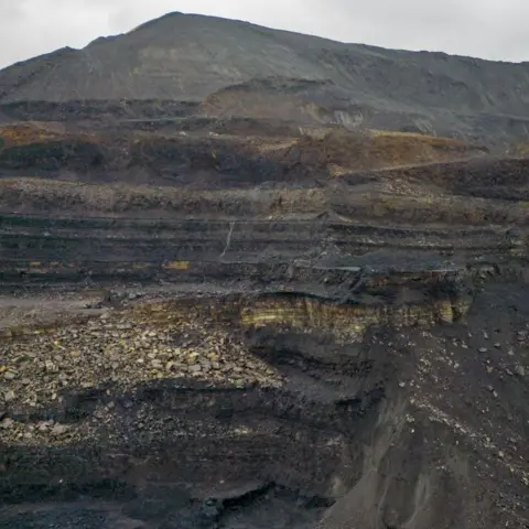 Matthew Horwood/Getty Images An aerial view from within the main mining void at Ffos-y-Fran - one of the overburden mounds can be seen rising above.