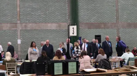 Harrison Cable/BBC Conservatives watch as ballots are counted in Rochford