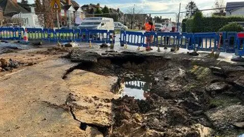 Burst water pipe on Kidmore Road, Caversham Heights, Berkshire