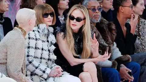 Getty Images British actress Tilda Swinton (L), British-US fashion editor Anna Wintour (2nd L) and Australian-US actress Nicole Kidman (C) speak together during the Chanel Women's Haute Couture Spring/Summer 2026 collection fashion show as part of the Paris Haute Couture Fashion Week, in Paris, on January 27, 2026.
