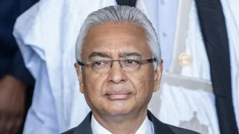 AFP A close-up shot of Pravind Jugnauth. He has grey hair and is wearing glasses.