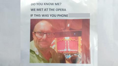 A poster with Jim Connelly's photo and phone number on it. It reads: "Do you know me? We met at the opera. If this was you phone..."