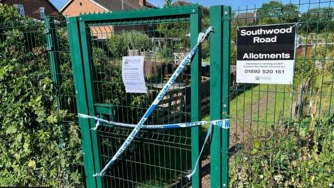 Police tape on the gate at the allotments