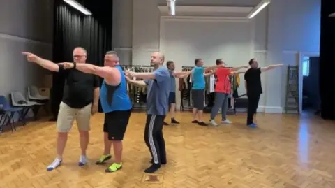 NAPA Dads rehearsing a dance routine at NAPA in Hull