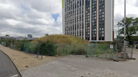 Google The site of the old Gala Bingo building at Fairfax Street in Coventry showing an empty site with a hill of earth just in front of a tower block