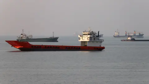 Vessels in the Strait of Hormuz near the beach of Bandar Abbas, Iran, June 21, 2026.