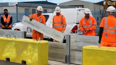 Guy Campbell/BBC Flood defences being installed in Lowestoft