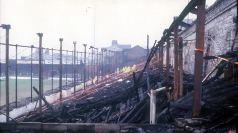 The blackened stands at the scene at Valley Parade in 1985 after the fire 