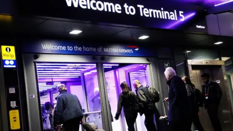  Passengers arrive at Heathrow's Terminal 5.