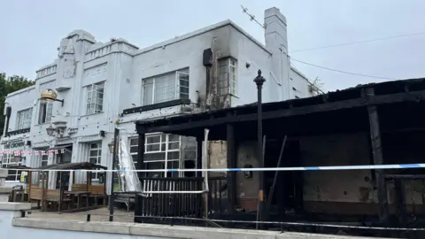 A pub front damage by a fire