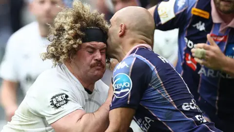 Alfie Barbeary is tackled high