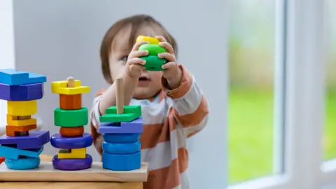 A child plays with building blocks