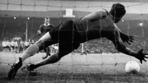 Hull City goalkeeper Ian McKechnie diving to save a penalty