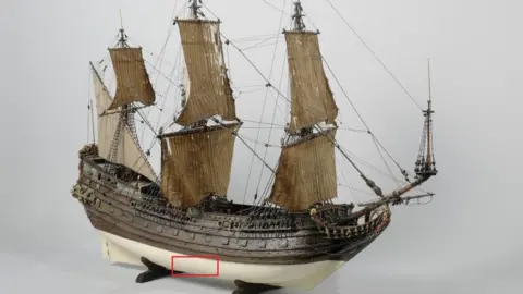 Bournemouth University A model of 16th century ship the Fame from Hoorn. A red square indicated where the hull is located in the lower part of the vessel. 