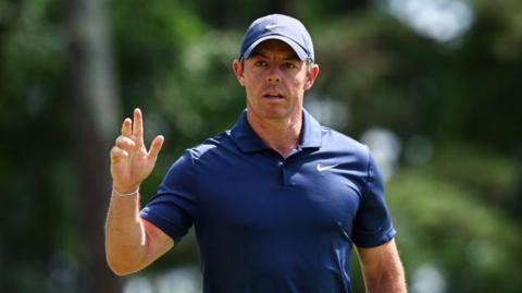 Rory McIlroy salutes the crowd