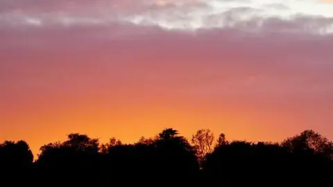 Susy and Dafydd/BBC A red and orange sky 